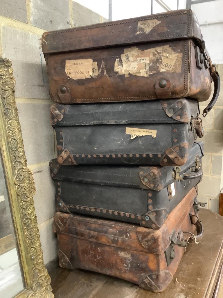 Four vintage leather cases, largest 68cm wide